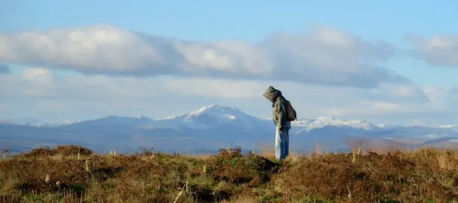 ECA student with snowy hill back drop at Drumbrae