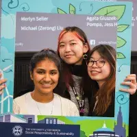 Trio of changemaker winners pose in SRS selfie frame