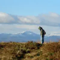 ECA student with snowy hill back drop at Drumbrae