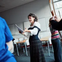 A person in costume reads from a script