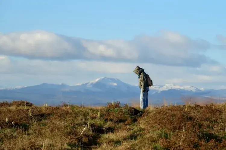 ECA student with snowy hill back drop at Drumbrae