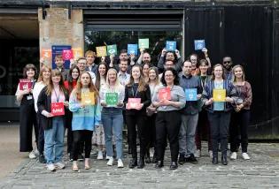 Social Responsibility and Sustainability staff holding up Sustainable Development Goal cards outside the Boilerhouse