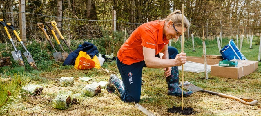 Someone planting a tree at the Big Dig 2021 - Photo credit: Andrew Perry and Sport & Exercise