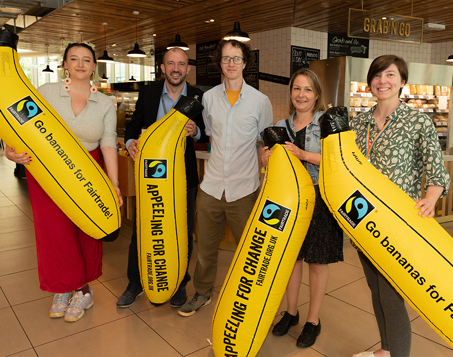 Fairtrade University Awards photoshoot Levels Cafe summer 2022. Inflatable bananas read: \"appeeling for change\"